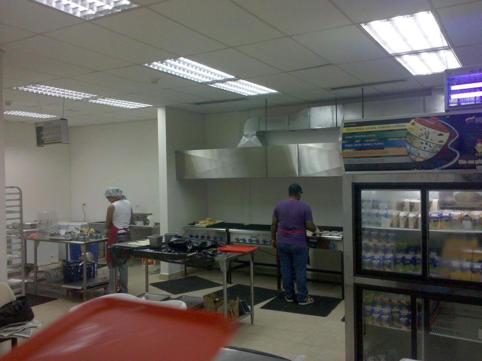 a restaurant has stainless steel appliances and cooking equipment