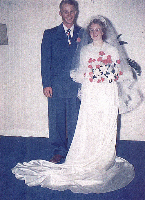 an old picture of a man and woman on their wedding day