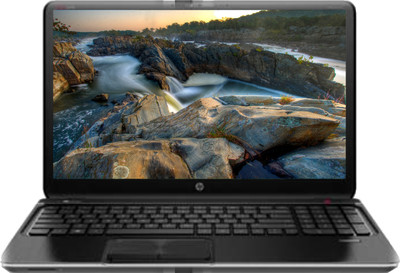 a laptop computer displaying a scenic scene on a screen