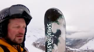 a snowboarder is in the snow with his snowboard