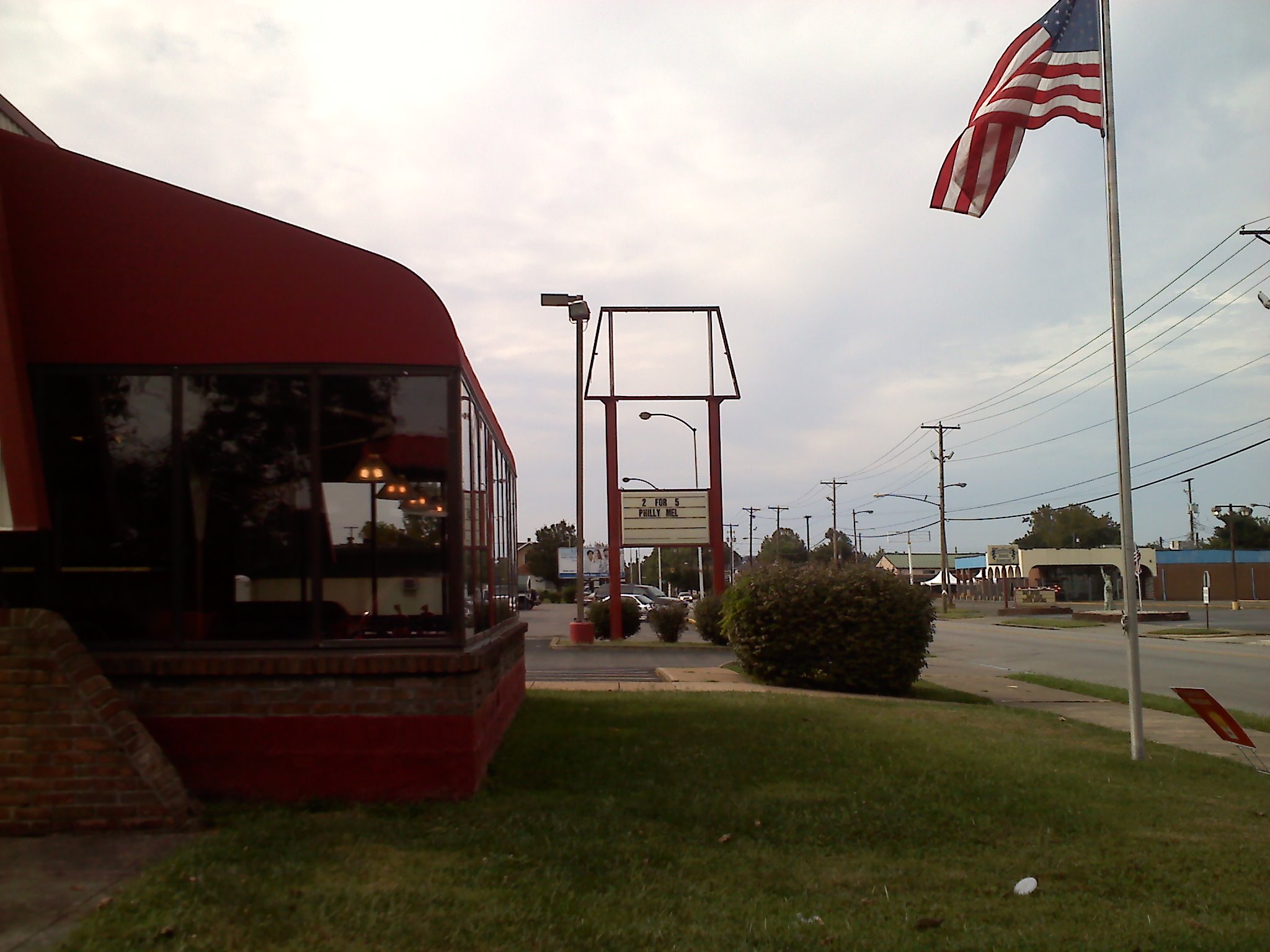 a small red building that is on the side of the street