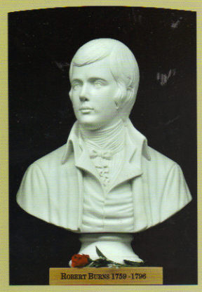 a bust of a person on a plaque with a rose