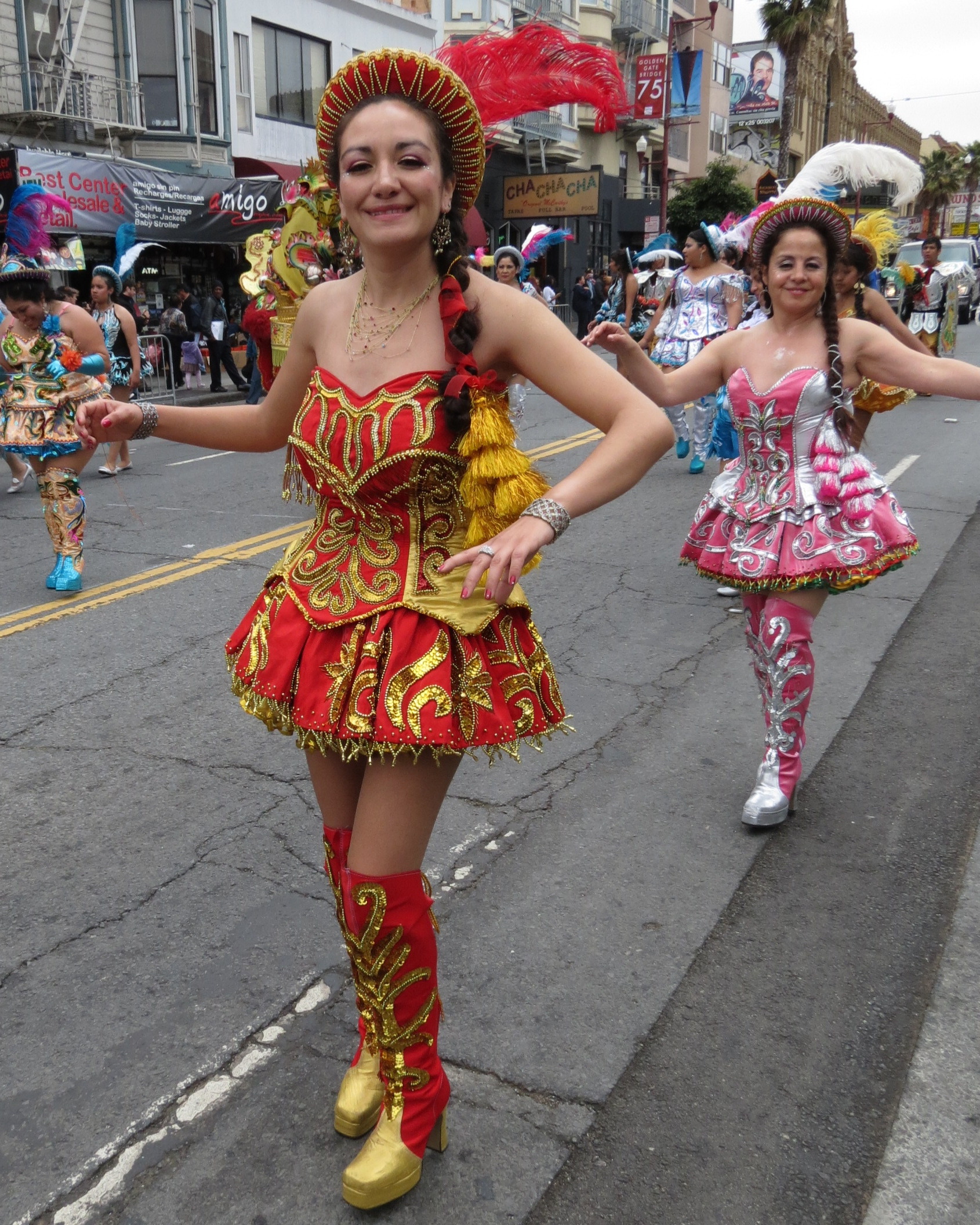 two girls dressed in costumes on a city street