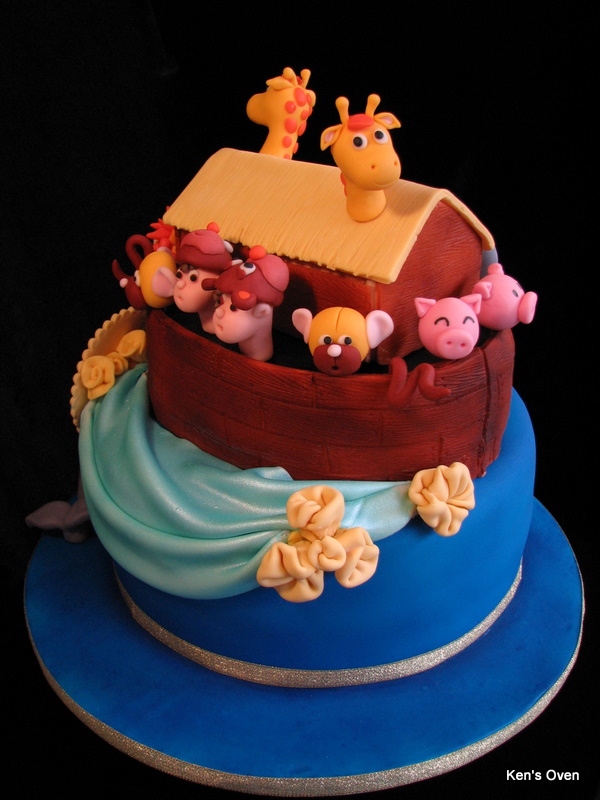 a three tier cake that looks like noah's ark