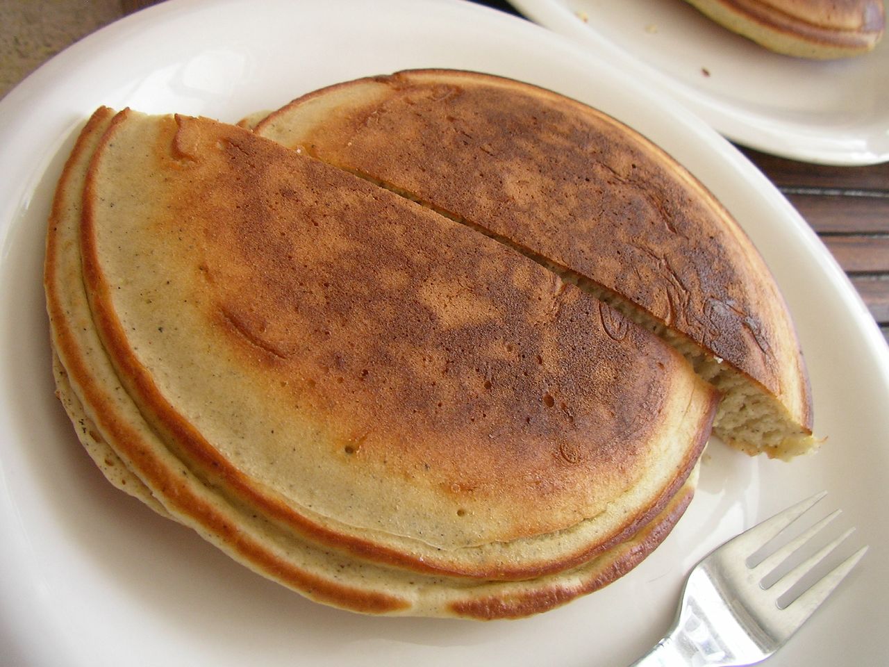 two plates with several pancake halves on them