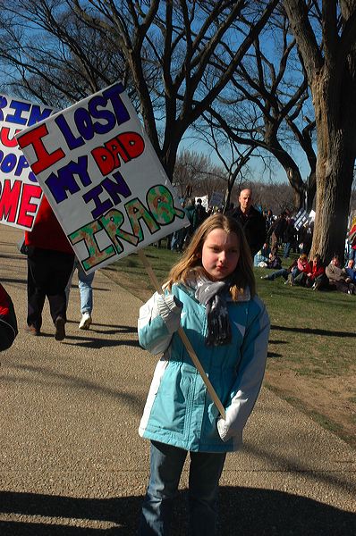 a girl with a sign saying, we lost our s this year