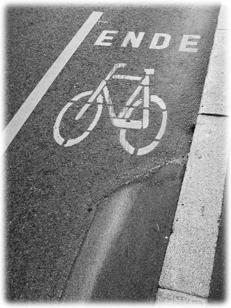 the word'en de bicycle'is written on the street