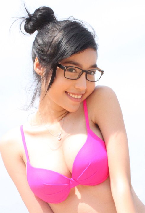 a pretty young lady in a pink bikini