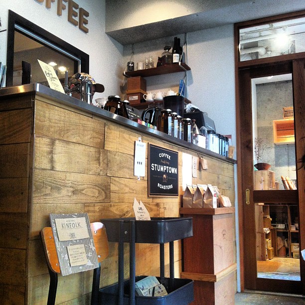 the inside of a coffee shop with a small counter