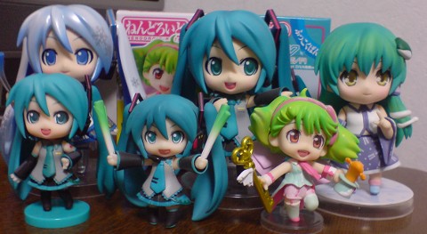 a group of anime dolls on a table