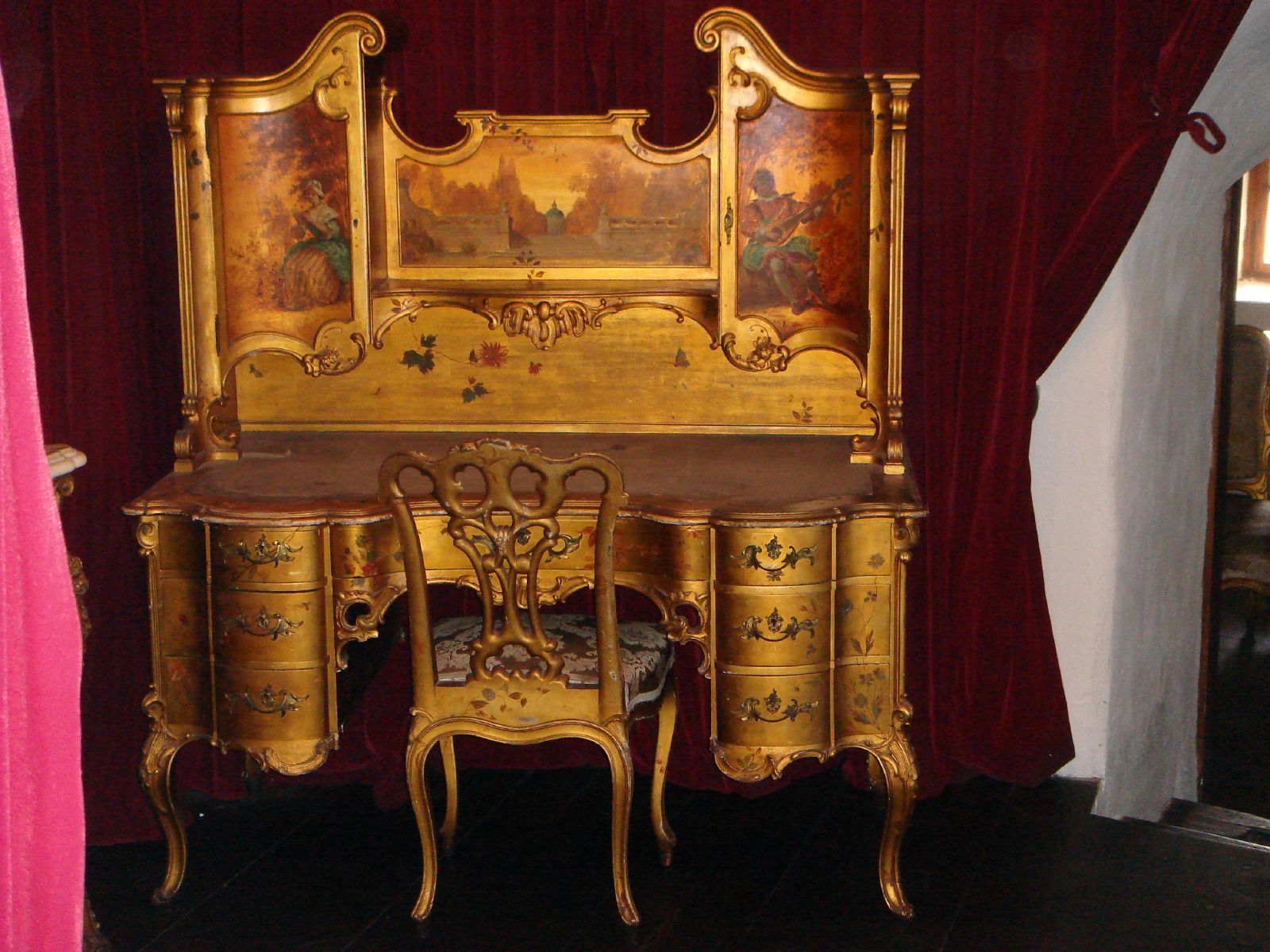 the vanity has gold painted flowers on it
