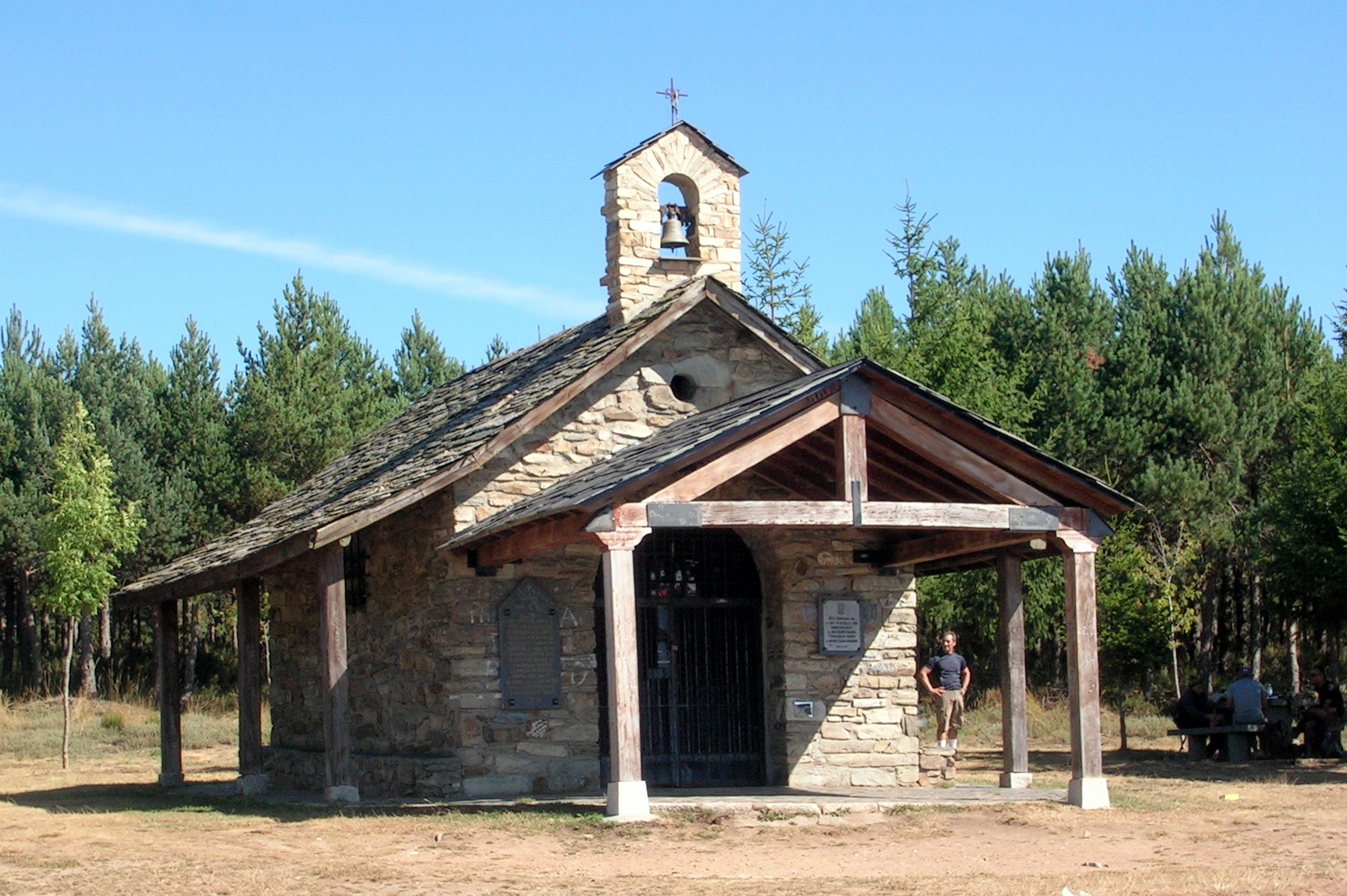 an old stone church stands on the side of the road