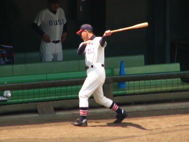 a batter swings his bat during a baseball game