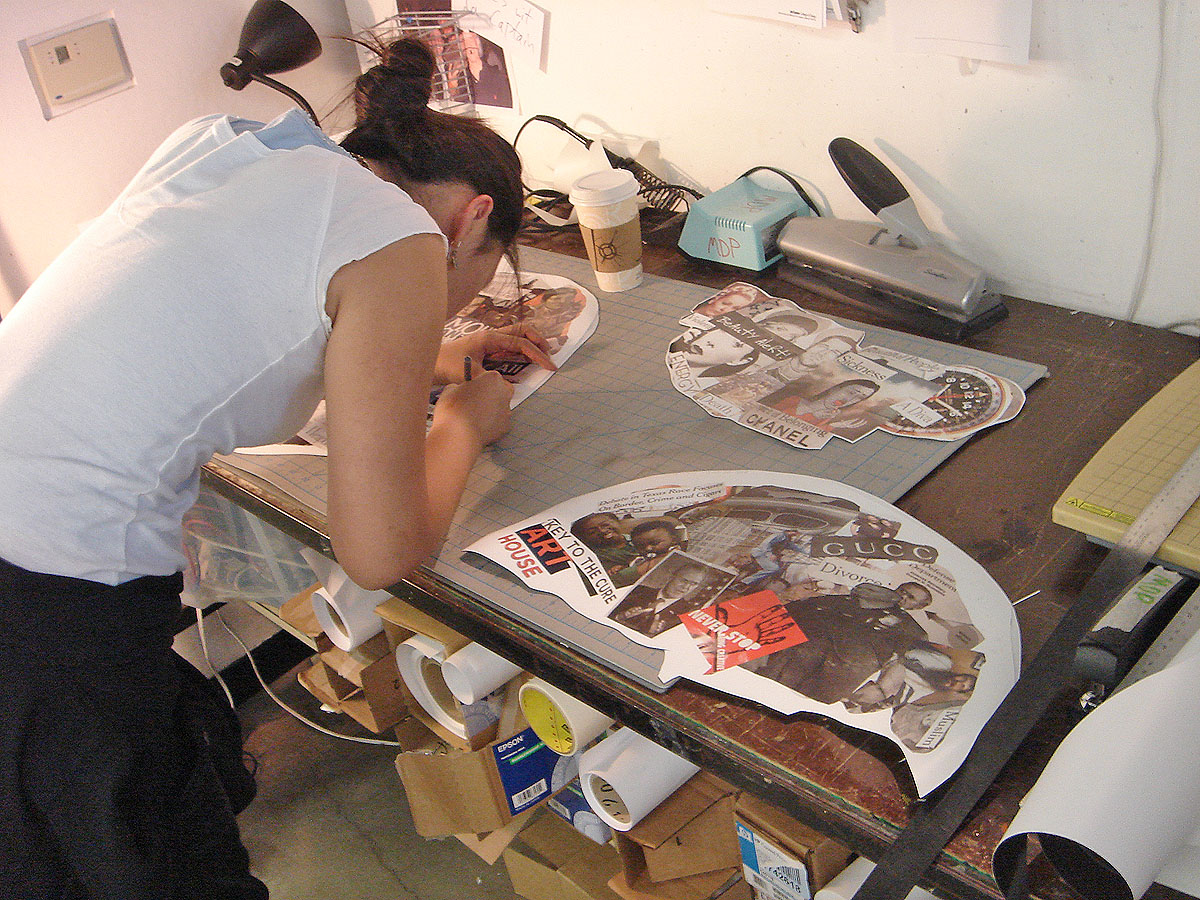 a woman works on a design using a machine