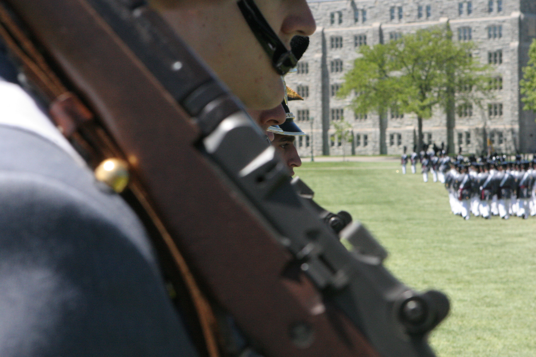 military personnel are gathered near two men in uniforms