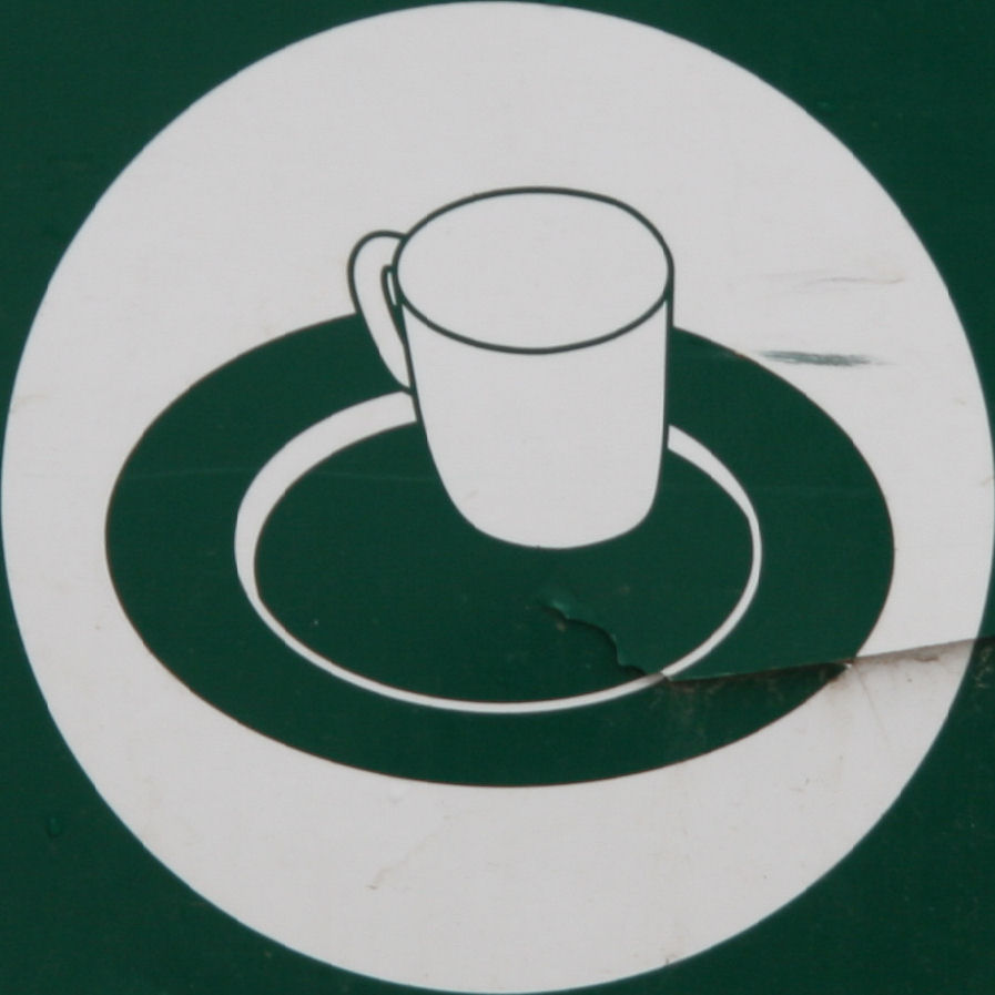 a picture with the outline of a cup and saucer on it