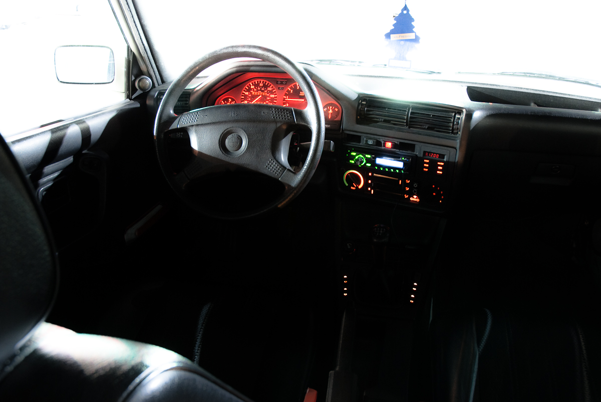an interior s of the dashboard and steering wheel