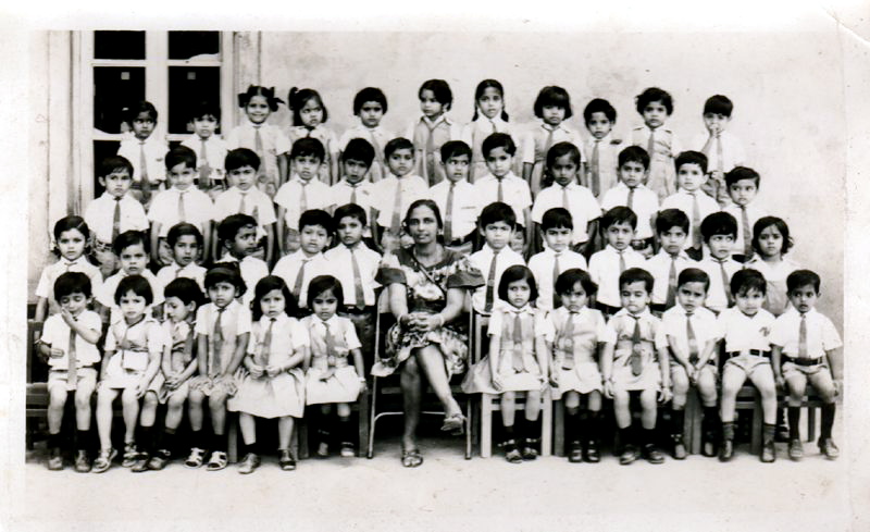 vintage pograph of children and teachers in school uniforms