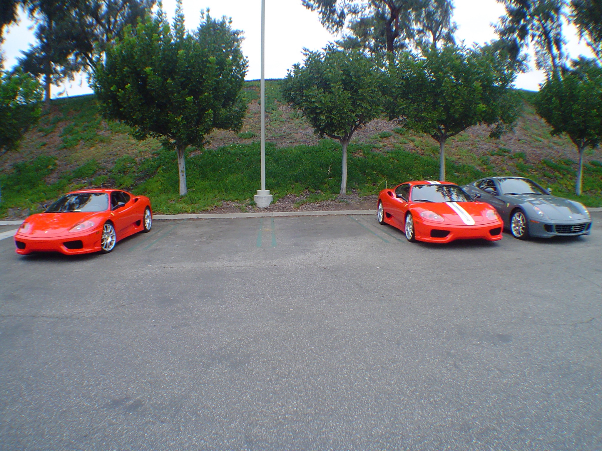 two supercars parked in a parking lot