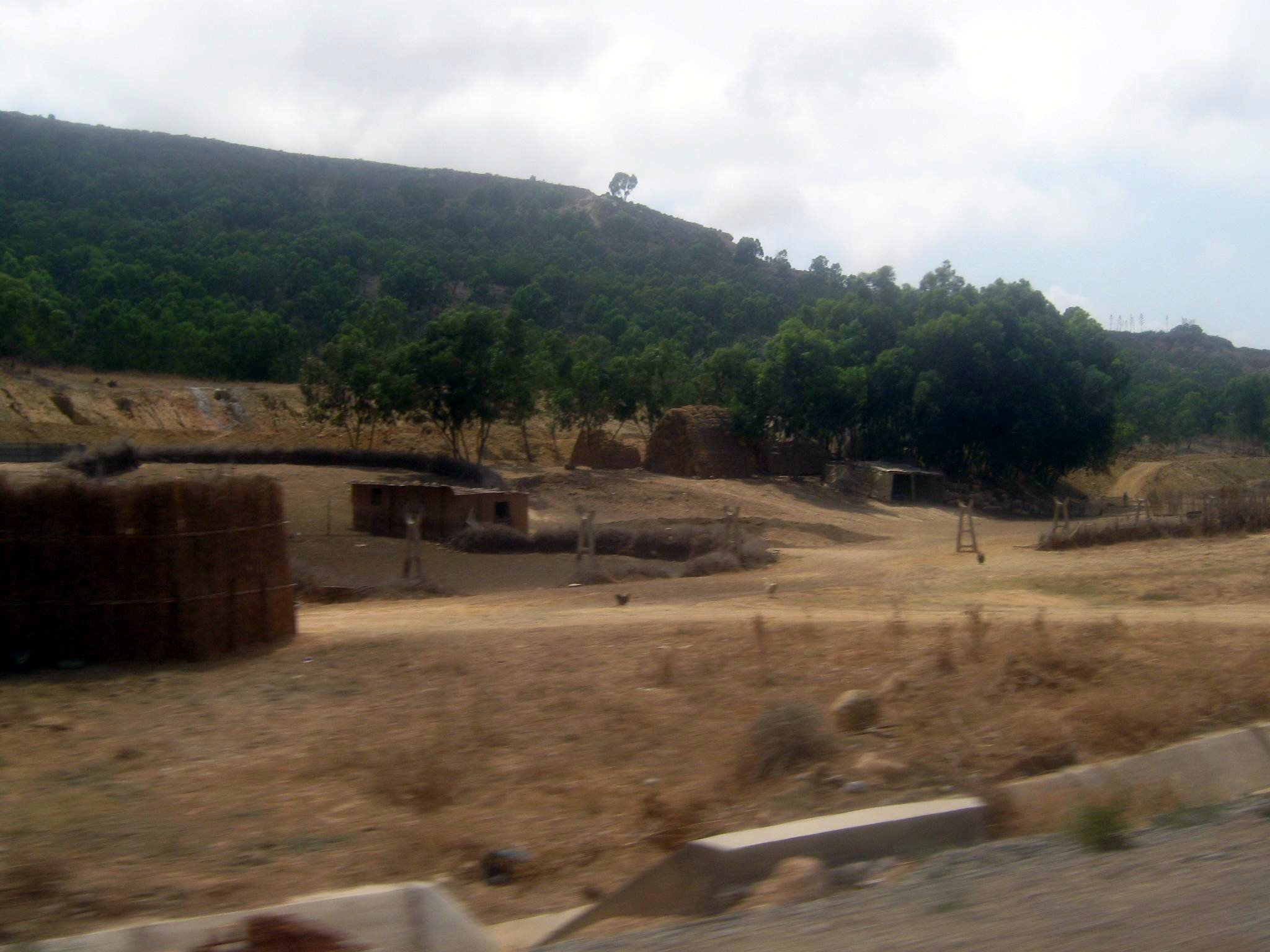 there is an empty field with a building in it