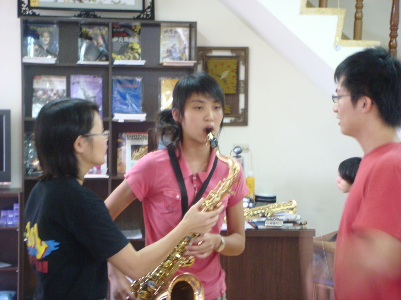 a woman and two children standing by each other