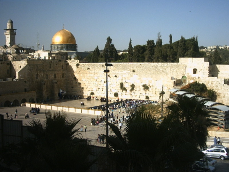 a very large building in the city with a view of the dome on the rock