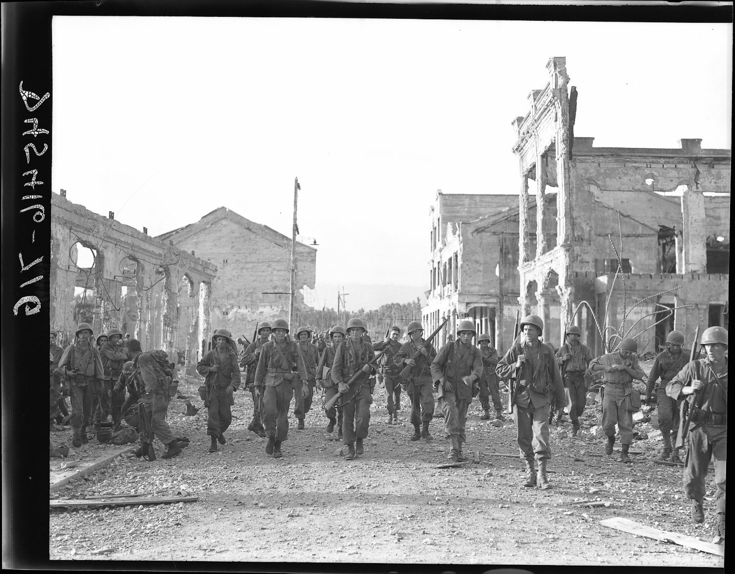 people in the streets walking in front of old buildings