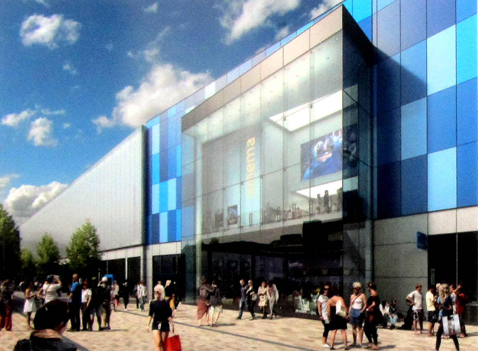 a group of people standing outside of a glass and steel building