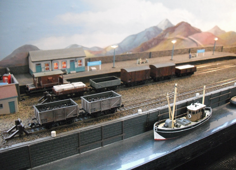 a toy model train and a little boat