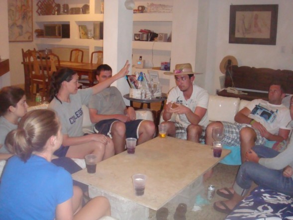 several people sitting around a coffee table