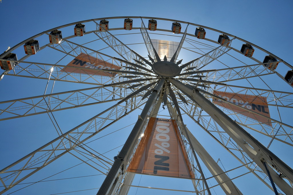 an image of the top of a ferris wheel with a banner