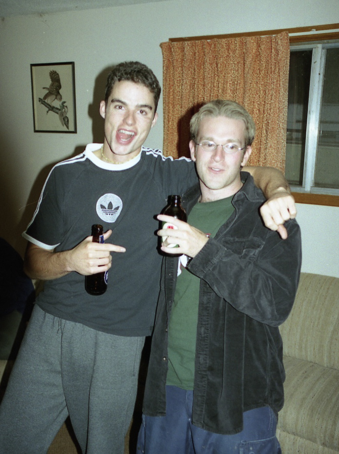 two men in the living room posing for the camera