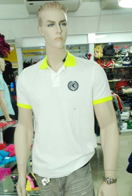 a mannequin heads are shown with clothes on display