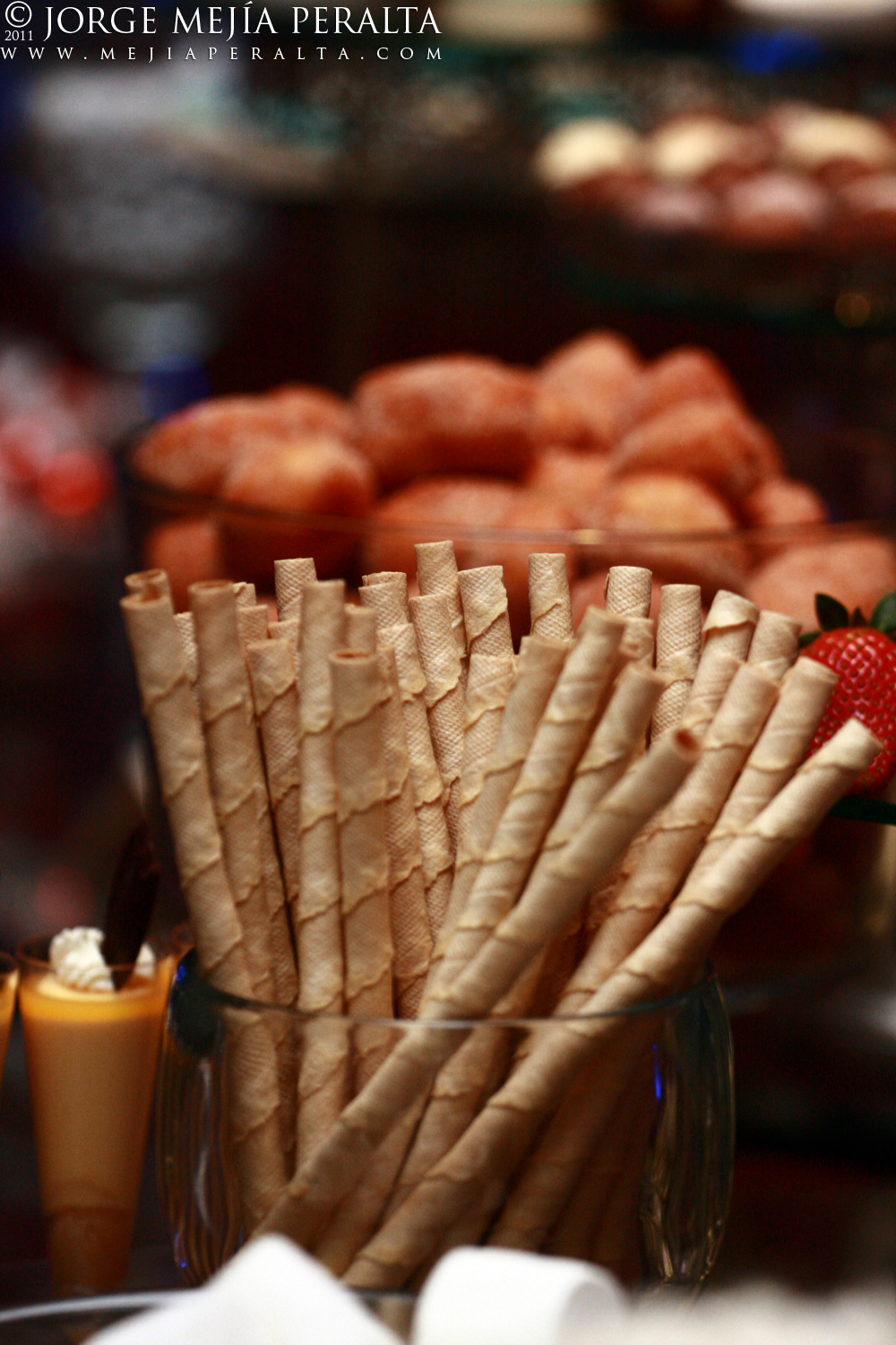 several different types of snacks in glass containers