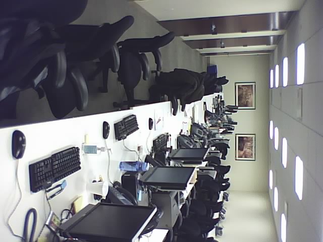 an office filled with many computers and computer monitors