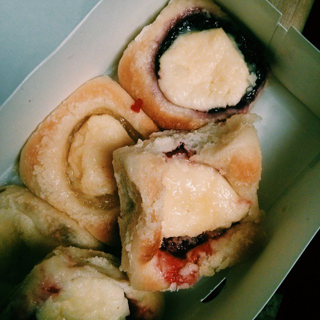 some pastries sitting in a box on top of a table
