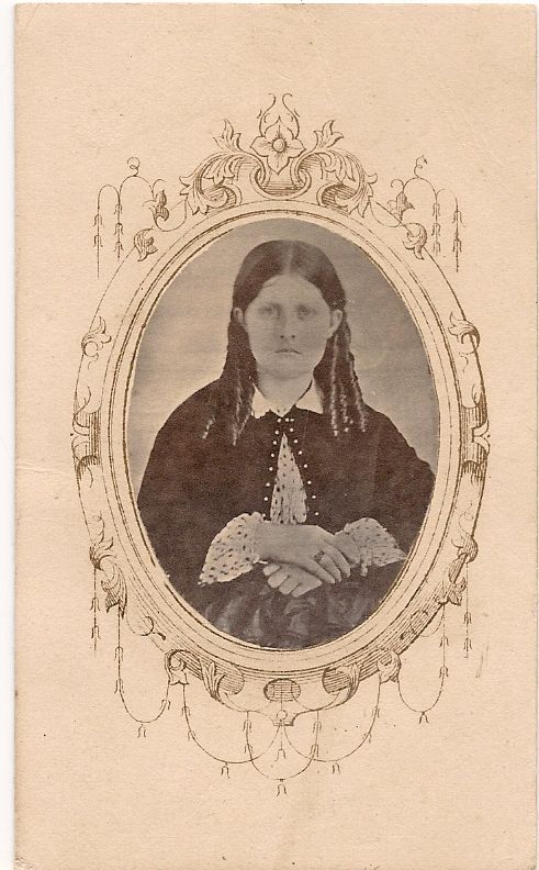 an antique po of a woman with ids