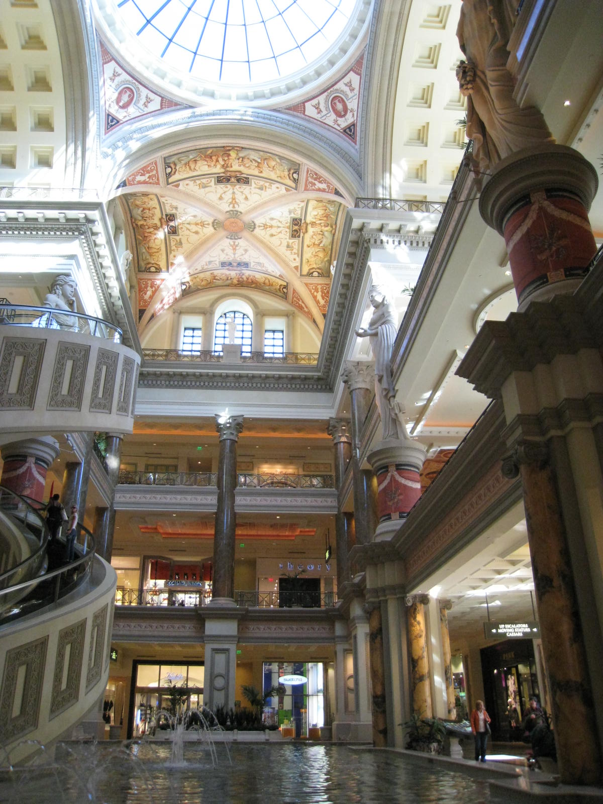 the inside of a shopping mall with marble floors