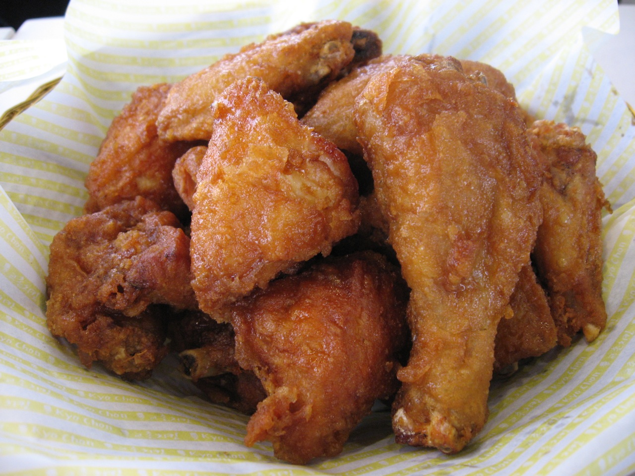 closeup view of fried food inside a paper basket