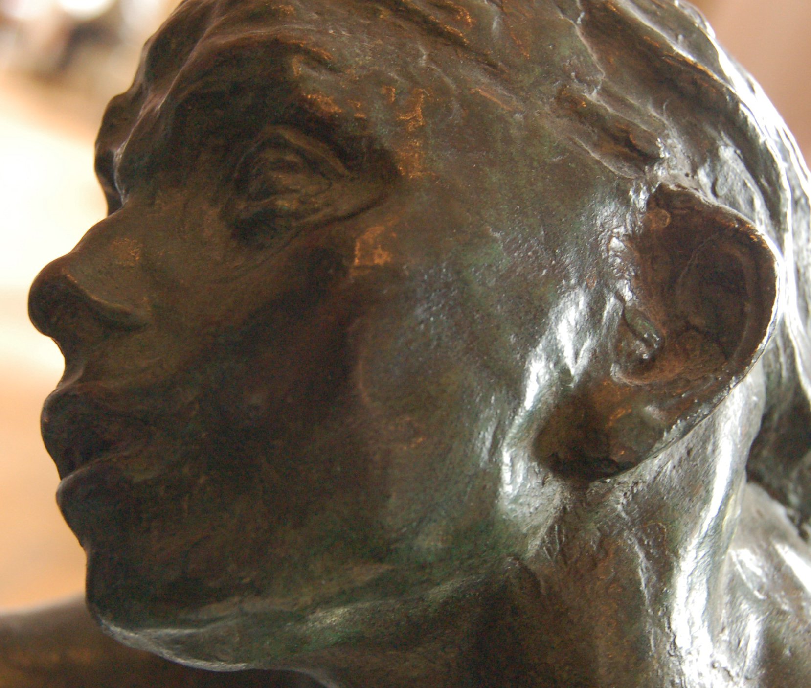 a statue of a person with his face facing down