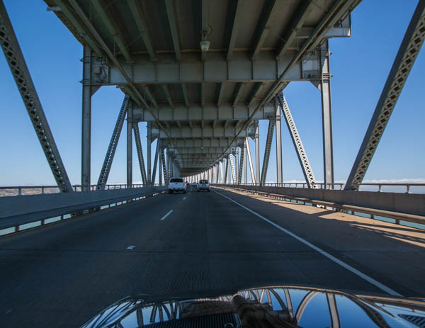 the view from inside the car looking over a bridge