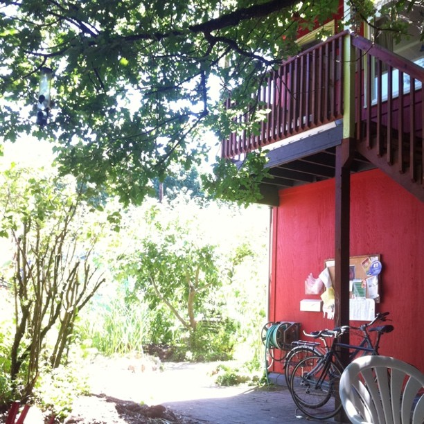 the walkway to a house is full of bicycles