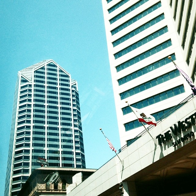 two tall buildings are near a building