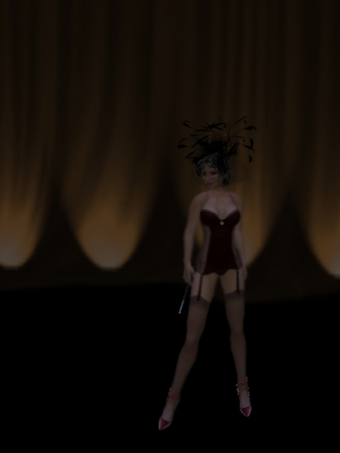 a female wearing tight lingerie and a feathered tail standing on stage with legs crossed