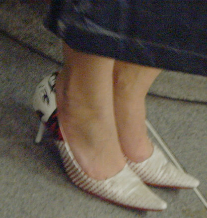 a person with the right leg up wearing shoes