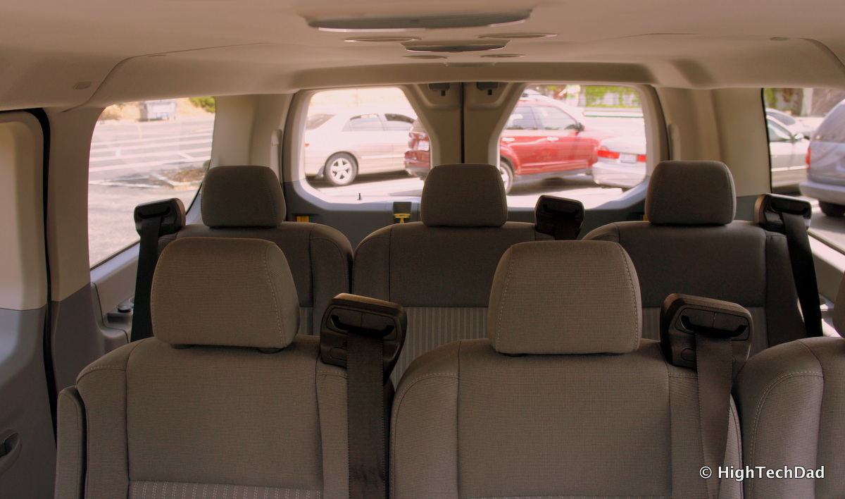 view from inside car with multiple seats and hatchback facing left