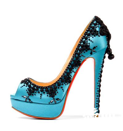 an extremely beautiful blue shoe with black jewels