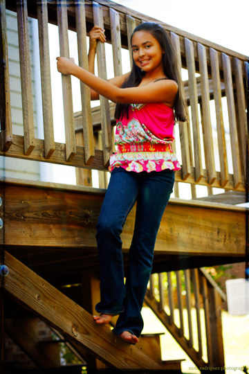  posing for camera on wooden porch