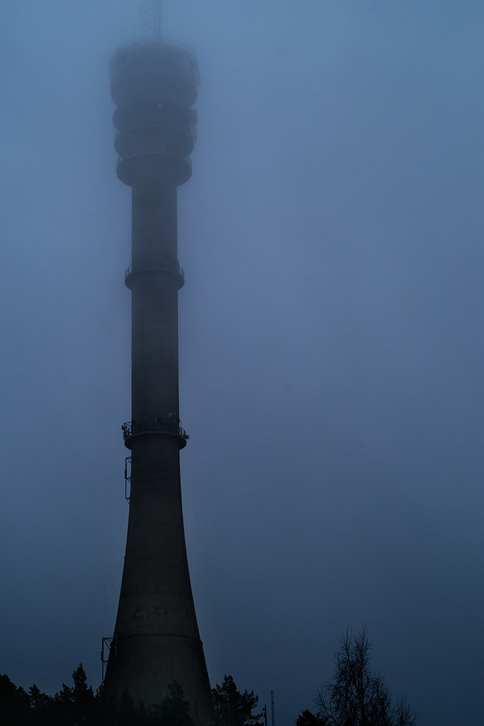 tower with light traffic lights in foggy weather