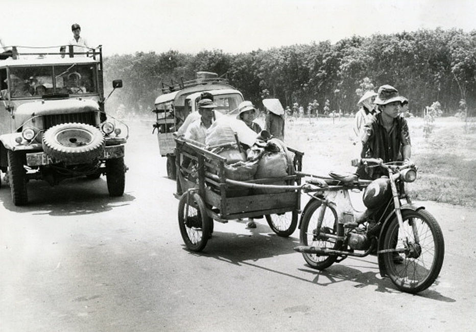 a horse - drawn carriage carrying luggage down a street